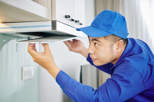 handyman-installing-cooker-hood-2021-08-27-21-23-56-utc-2
